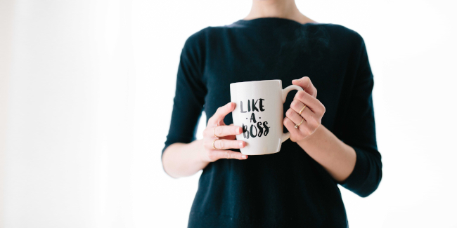 woman holding a mug with Like a Boss